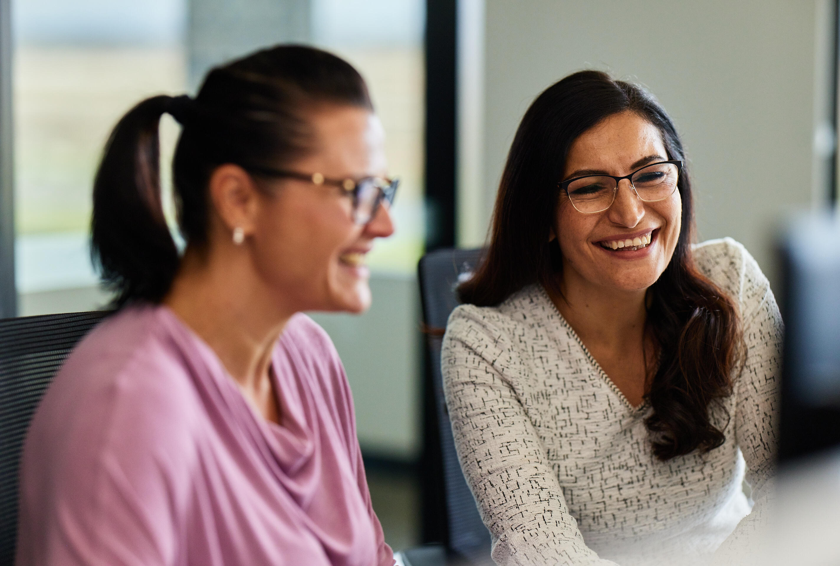two women working together